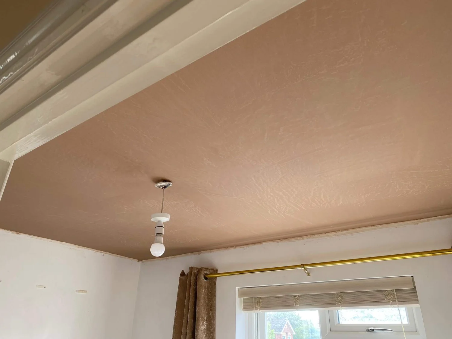 Fresh skim coat on a living room ceiling