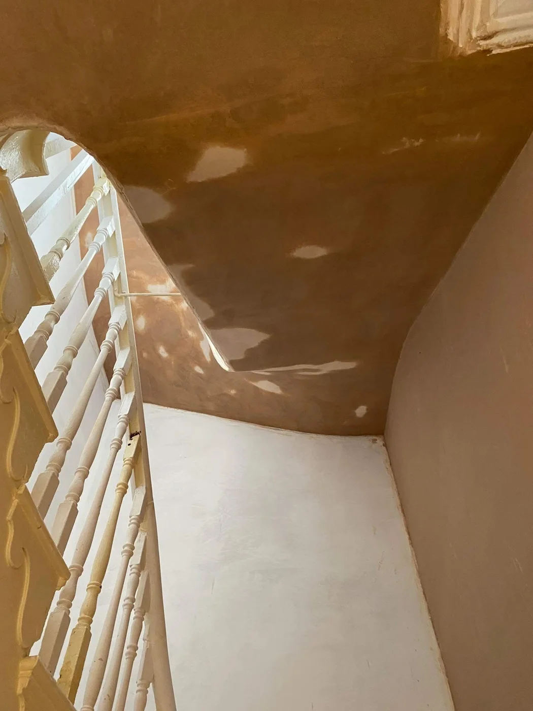 Plasterwork following the curve of a staircase